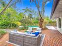 Inviting outdoor brick patio with comfortable seating, perfect for relaxing and entertaining near the pool at 2350 Worthington Rd, Maitland, FL 32751