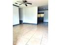 Bright and airy living room with tile flooring and modern ceiling fan at 3463 Fekany Pl, Orlando, FL 32805