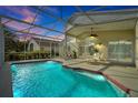 Relaxing screened-in pool area, perfect for outdoor dining and entertaining with sunset views at 80 White Marsh Cir, Orlando, FL 32824