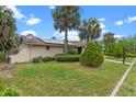 Charming single-story home with well-manicured lawn, desert landscaping, and inviting entrance at 820 Hobson St, Longwood, FL 32750