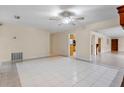 Spacious open-plan living room featuring tile flooring and a ceiling fan at 820 Hobson St, Longwood, FL 32750