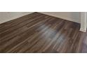 Close-up of attractive new brown laminate wood flooring in the house at 8563 Compass Point Ave, Orlando, FL 32832