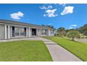 Charming single story home with an inviting front porch with decorative brick and a well manicured lawn at 105 Spring Cove Trl, Altamonte Springs, FL 32714