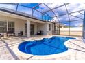 Sparkling screened-in pool with a paved deck, ideal for relaxation and outdoor entertaining at 113 Venetian Bay Cir, Sanford, FL 32771