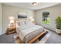 Cozy main bedroom featuring neutral color palettes, natural light and stylish decor at 131 Pecan Pass, Ocala, FL 34472