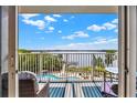 Balcony view showcasing a beautiful waterfront view with a pool at 13415 Blue Heron Beach Dr # 409, Orlando, FL 32821