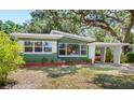 Single-story home featuring a carport and well-maintained landscaping at 141 S Lawsona Blvd, Orlando, FL 32801