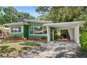Charming single-story home featuring a carport and well-maintained landscaping at 141 S Lawsona Blvd, Orlando, FL 32801