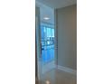 Hallway overlooking the city with floor-to-ceiling windows and modern finishes at 150 E Robinson St # 2002, Orlando, FL 32801