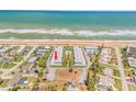 Aerial view showcasing the condo's proximity to the ocean, community pool, and surrounding neighborhood at 2750 Ocean Shore Blvd # 350, Ormond Beach, FL 32176