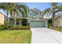 Charming two-story home boasts lush landscaping, a two-car garage, and a welcoming front entrance at 2842 Balforn Tower, Winter Garden, FL 34787