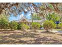 Attractive home exterior with mature landscaping and Spanish moss-draped trees at 2927 Ahern Dr, Orlando, FL 32817