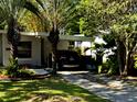A charming single-story house with a driveway offers convenient parking and curb appeal at 318 E Jersey St, Orlando, FL 32806