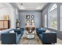 Comfortable living area with modern furniture, natural light, and stylish decor at 3891 Brantley Place Cir, Apopka, FL 32703