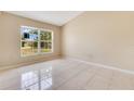 Spacious bedroom with tile flooring, natural light, and a neutral color palette at 514 Richmond Ave, Deltona, FL 32725