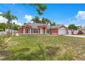 Attractive single-story home with a manicured lawn and an attached two-car garage at 514 Richmond Ave, Deltona, FL 32725