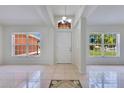 Bright foyer featuring tiled flooring, high ceilings, and natural light at 514 Richmond Ave, Deltona, FL 32725