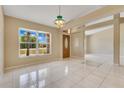 Bright living room with large windows, tile flooring, and an open layout for modern living at 514 Richmond Ave, Deltona, FL 32725