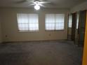 Bright, carpeted bedroom with ample natural light and mirrored closet doors at 672 Post Oak Cir # 106, Altamonte Springs, FL 32701