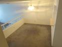 Cozy living space featuring neutral carpet and contemporary lighting at 672 Post Oak Cir # 106, Altamonte Springs, FL 32701