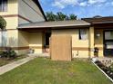 Townhouse features a fenced front yard, a fresh exterior paint job, and well-maintained landscaping at 963 Stucki Ter, Winter Garden, FL 34787