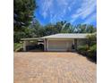 Spacious two-car garage with a brick driveway at 1010 Bolton Rd, New Smyrna Beach, FL 32168