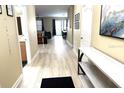 Bright hallway leading to the living area, with views of bathroom and living space at 1466 Moon Valley Dr, Champions Gate, FL 33896