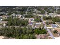A high angle neighborhood view showcasing the home's placement in a wooded residential area at 16600 Sw 23Rd Avenue Rd, Ocala, FL 34473