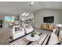 View of living room showcasing kitchen and dining area that is perfect for relaxing and entertaining at 2708 La Posada Dr, The Villages, FL 32162