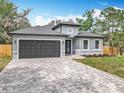 Charming one-story home with a gray exterior, complemented by a well-manicured lawn and a paved driveway at 278 Acorn Dr, Longwood, FL 32750