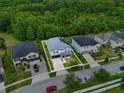 Aerial view of a two-story home with brick driveway and green landscaping at 2926 Boating Blvd, Kissimmee, FL 34746