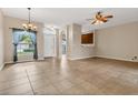 Spacious living room features tile flooring, abundant natural light, and an open layout at 2975 White Cedar Cir, Kissimmee, FL 34741