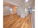 Open-concept living room with wood-look floors and neutral paint at 3146 Byington Terrace Ter, Deltona, FL 32738