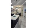 Bright dining area adjacent to the kitchen, featuring modern lighting and a view to the outside at 3986 Bedford Ave, Winter Haven, FL 33884