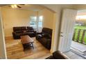 Comfortable living area with wood-look floors, neutral walls, and great natural light at 412 Bay Nw St, Fort Meade, FL 33841