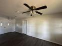 Bright living room with new flooring, ceiling fan, and fresh paint at 5123 Turnbull Dr, Orlando, FL 32812