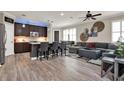 Open-concept living area with modern furnishings and natural light at 5464 Factors Walk Dr, Sanford, FL 32771