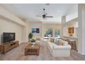 Bright living room with neutral tones, ceiling fan, and bar top at 626 Green Rock Ct, Apopka, FL 32712