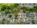 Aerial view of the property highlighting its location and surrounding neighborhood with mature trees for a serene environment at 6411 Merriewood Dr, Orlando, FL 32818