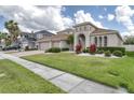 Well-maintained home with a three car garage, beautiful landscaping and a manicured lawn at 839 Timber Isle Dr, Orlando, FL 32828