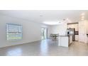 Bright and spacious kitchen with stainless steel appliances and an island with a sink at 942 Jackson Ave, Davenport, FL 33837