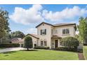 Beautiful home showcasing the well-maintained landscaping and classic architecture at 123 Tangelo Court, Maitland, FL 32751