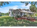 A well-maintained townhome next to a serene lake offers beautiful landscaping at 14650 Laguna Beach Cir, Orlando, FL 32824