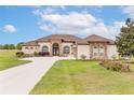 Beautiful home with manicured lawn and landscaping, long driveway at 35651 Huff Rd, Eustis, FL 32736