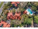 Aerial view of townhomes with community pool surrounded by mature trees at 546 Via Fontana Dr # 203, Altamonte Springs, FL 32714