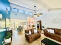Bright living room showcasing vaulted ceilings, tile floors and an open-concept design at 6653 Se 87Th St, Ocala, FL 34472