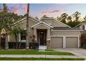 Charming single-story home with a well-manicured lawn, neutral paint and a two car garage, perfect for modern living at 9534 Piccadilly Sky Way, Orlando, FL 32827