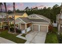 Beautifully landscaped home with a two-car garage and a charming entrance, perfect for Gathering living at 9534 Piccadilly Sky Way, Orlando, FL 32827