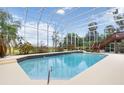 Indoor pool with screened enclosure, natural light and view of outdoors at 1093 Hidden Harbor Ln, Kissimmee, FL 34746
