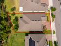 A neatly maintained roof, well-kept lawn, and adjacent trees enhance the home's appeal at 11054 Cyrilla Woods Dr, Orlando, FL 32832
